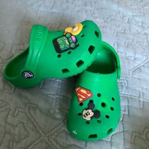Green crocs with charms